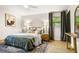 Bedroom with natural light, wooden accents and comfortable bedding at 2152 Tourney Dr, Marietta, GA 30062