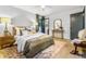 Bedroom with wood accents, lamps and neutral bedding at 2152 Tourney Dr, Marietta, GA 30062
