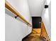 Staircase with wood railings, black painted stringers, and wood flooring on the steps at 2152 Tourney Dr, Marietta, GA 30062