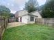 A single-story home featuring a small backyard patio and a yard with green grass at 2617 Terrace Pkwy, Morrow, GA 30260