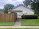 Modest single-story home featuring a small, fenced yard and concrete walkway at 2617 Terrace Pkwy, Morrow, GA 30260