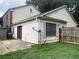 This single-story home has a small backyard patio and is sided with clapboards at 2617 Terrace Pkwy, Morrow, GA 30260