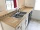 A tidy kitchen area features white cabinets, laminate countertops, and stainless steel sink at 2617 Terrace Pkwy, Morrow, GA 30260