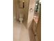 Small bathroom with toilet, tile flooring and a cabinet sink with a full vanity mirror at 3358 Stonecrest Ct, Atlanta, GA 30341