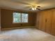 Spacious bedroom with built-in cabinetry and a bright window offering a lovely outdoor view at 3358 Stonecrest Ct, Atlanta, GA 30341