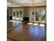 Bright dining room featuring hardwood floors, light gray walls, and glass patio doors at 3358 Stonecrest Ct, Atlanta, GA 30341