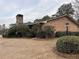 Charming home with brick facade, chimney, and mature landscaping at 3358 Stonecrest Ct, Atlanta, GA 30341