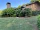 Well-maintained brick home showcasing lush landscaping and a classic stone chimney at 3358 Stonecrest Ct, Atlanta, GA 30341