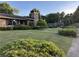Charming brick home with a stone chimney and well-manicured landscaping in a suburban neighborhood at 3358 Stonecrest Ct, Atlanta, GA 30341