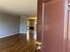 Open living space featuring hardwood floors, with a view into the dining room at 3358 Stonecrest Ct, Atlanta, GA 30341