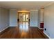Spacious living room features hardwood floors, light gray walls, and a view of the dining area at 3358 Stonecrest Ct, Atlanta, GA 30341