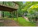 Backyard features a deck with lush greenery and privacy fence at 706 Cather Ct, Stone Mountain, GA 30088
