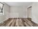 Bright bedroom with a closet, modern wood floors, and a large window at 706 Cather Ct, Stone Mountain, GA 30088