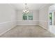 Bright dining room with modern chandelier and ample light at 706 Cather Ct, Stone Mountain, GA 30088