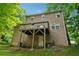 Two-story home with a deck overlooking a spacious yard at 706 Cather Ct, Stone Mountain, GA 30088