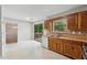 Cozy kitchen featuring wooden cabinets, laminate countertops, and stainless steel appliances, with a view to the backyard at 706 Cather Ct, Stone Mountain, GA 30088