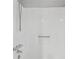 Clean white shower features a shower head and faucet at 706 Cather Ct, Stone Mountain, GA 30088