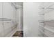 Organized walk-in closet featuring white wire shelving units at 706 Cather Ct, Stone Mountain, GA 30088