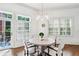 Sunlit dining area with round table, stylish chairs, and views of the outdoor patio at 1717 N Decatur Ne Rd # 322, Atlanta, GA 30307
