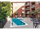 Inviting community pool area with comfortable lounge chairs and lush landscaping for relaxing at 1717 N Decatur Ne Rd # 322, Atlanta, GA 30307