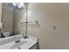 Bright bathroom featuring a large sink, decorative wall art, and neutral walls at 4512 Evan Ct, Hoschton, GA 30548
