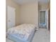 Bedroom with neutral walls, a bed with floral pattern, and carpeted floors for a comfortable space at 4512 Evan Ct, Hoschton, GA 30548