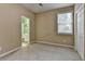 Bedroom with a window and a view to an ensuite bathroom at 4512 Evan Ct, Hoschton, GA 30548
