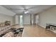Bonus room with hardwood-style floors, ceiling fan, and multiple doorways at 4512 Evan Ct, Hoschton, GA 30548
