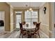 Bright breakfast nook featuring a table, chairs, and lots of natural light from large windows at 4512 Evan Ct, Hoschton, GA 30548
