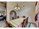 Dining room showcases chair rail and decorative lighting in an open-concept layout at 4512 Evan Ct, Hoschton, GA 30548
