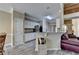 Modern kitchen with stainless steel appliances, white cabinets, and a breakfast bar at 4512 Evan Ct, Hoschton, GA 30548