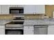 Well-equipped kitchen featuring stainless steel appliances and granite countertops at 4512 Evan Ct, Hoschton, GA 30548