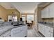 Spacious kitchen with white cabinets, granite countertops, and an eat-in breakfast nook at 4512 Evan Ct, Hoschton, GA 30548