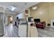 Spacious kitchen flowing into the living area, showcasing stainless appliances and granite counters at 4512 Evan Ct, Hoschton, GA 30548