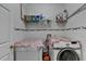 Laundry room featuring a washer and dryer, along with ample shelving for storage at 4512 Evan Ct, Hoschton, GA 30548