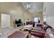 The living room features vaulted ceiling, fireplace, and leather furniture at 4512 Evan Ct, Hoschton, GA 30548