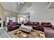 Living room with vaulted ceilings, fireplace, and views into kitchen and dining areas at 4512 Evan Ct, Hoschton, GA 30548