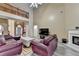 Open-concept living area features vaulted ceilings, fireplace, and staircase at 4512 Evan Ct, Hoschton, GA 30548