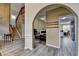 Open-concept living spaces feature hardwood floors, staircase, and modern decor at 4512 Evan Ct, Hoschton, GA 30548