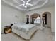 Comfortable main bedroom with trey ceiling, arched entryways, and ample natural light at 4512 Evan Ct, Hoschton, GA 30548