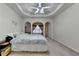 Well-lit main bedroom with tray ceiling, sitting area, and plenty of space at 4512 Evan Ct, Hoschton, GA 30548