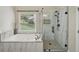 Modern bathroom with a separate shower, soaking tub, and tile surround at 5030 Princeton Trce, Cumming, GA 30041