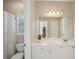 Bright bathroom with white cabinets, a large mirror, and neutral colors at 5030 Princeton Trce, Cumming, GA 30041