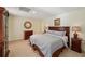 Comfortable bedroom with carpet, lamps, and neutral colors create a relaxing atmosphere at 5030 Princeton Trce, Cumming, GA 30041