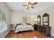 Cozy bedroom with hardwood floors, natural light, and neutral paint at 5030 Princeton Trce, Cumming, GA 30041