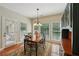 Bright breakfast nook with natural light, a table set, and wood flooring at 5030 Princeton Trce, Cumming, GA 30041