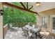 Spacious covered deck with seating, dining table, and ceiling fan, perfect for outdoor entertaining at 5030 Princeton Trce, Cumming, GA 30041