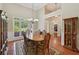 Dining room featuring a wood table set, large windows, and wood floors at 5030 Princeton Trce, Cumming, GA 30041