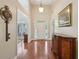 Welcoming foyer featuring wood floors, high ceilings, and a decorative buffet cabinet at 5030 Princeton Trce, Cumming, GA 30041