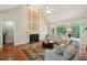Bright living room with high ceilings, a fireplace, and a large window overlooking the deck at 5030 Princeton Trce, Cumming, GA 30041
